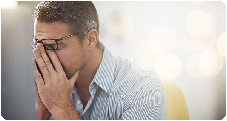 Man experiencing a headache or distress