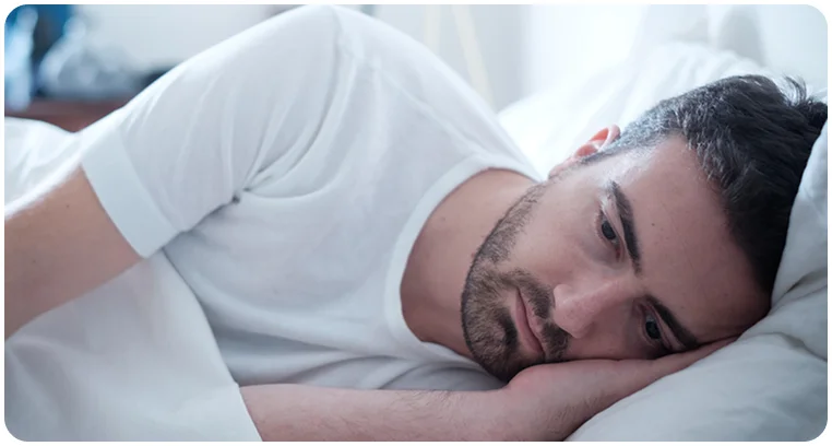 man experiencing sleep problems or insomnia