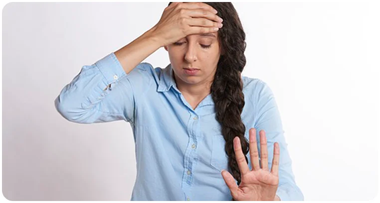 woman distressed headache migraine symptoms
