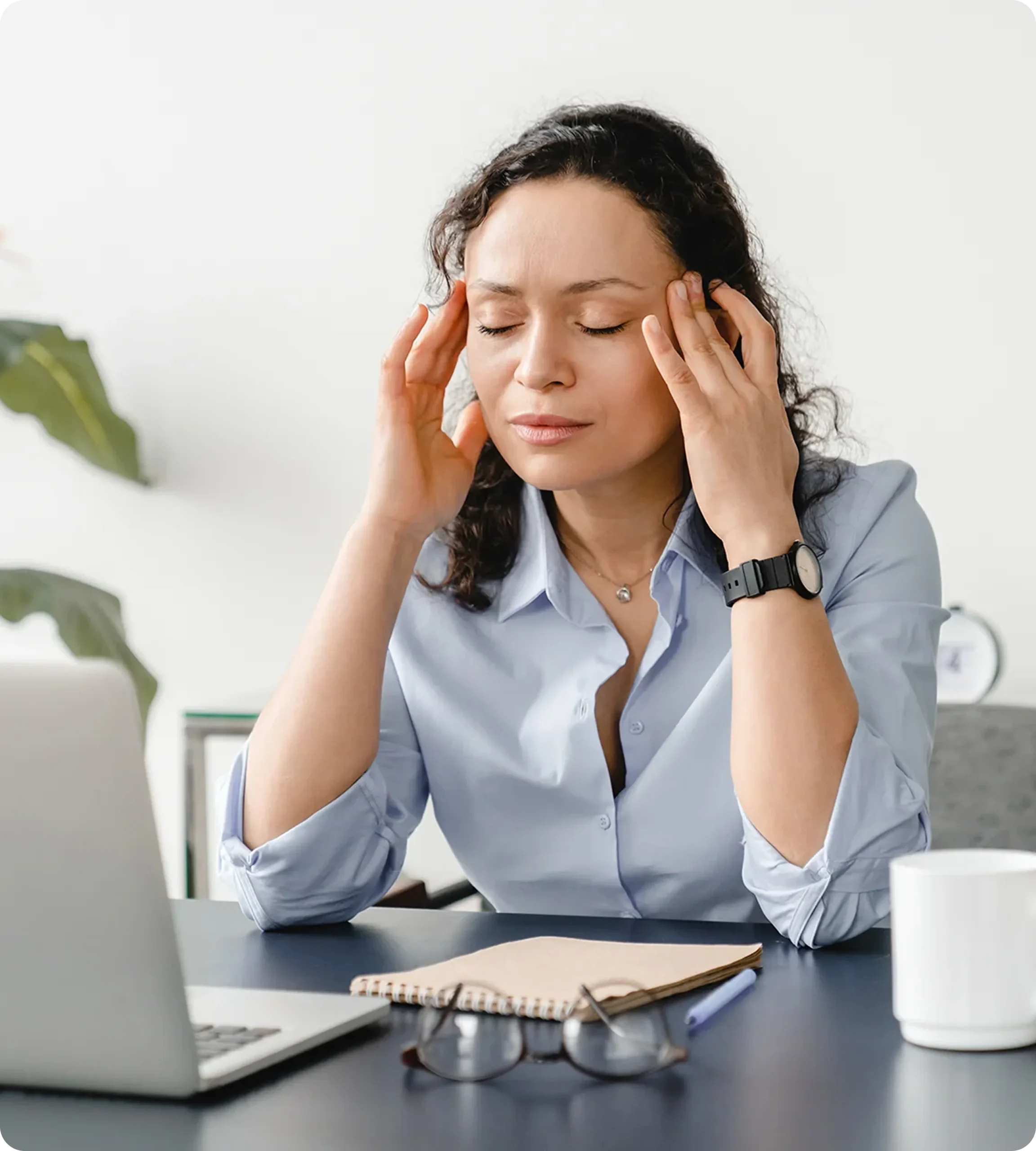 woman migraine headache desk pain