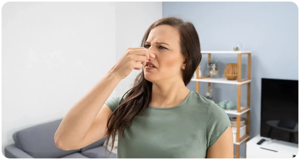 woman pinching nose sensory aura epilepsy